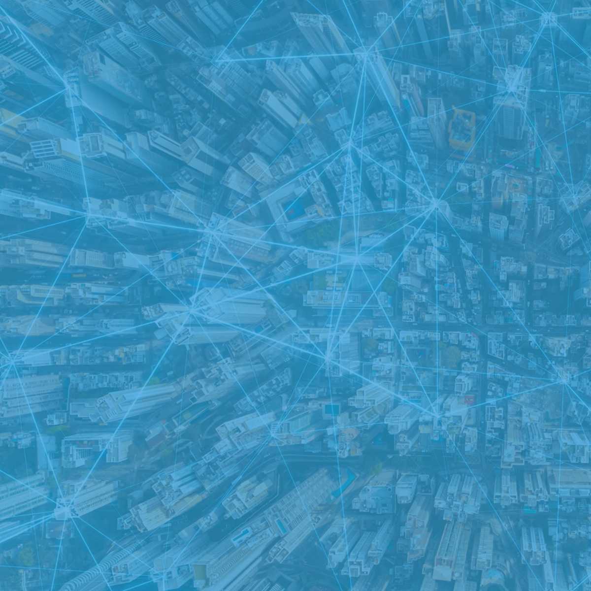 Overview of a city with digital lines connecting points of the city.